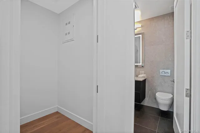 a bathroom view of a toilet and a sink