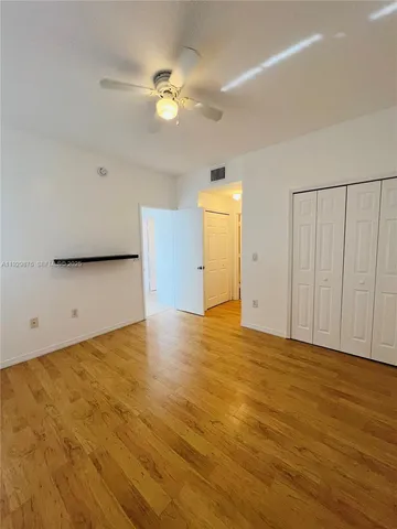 a view of a bathroom with a sink and a mirror