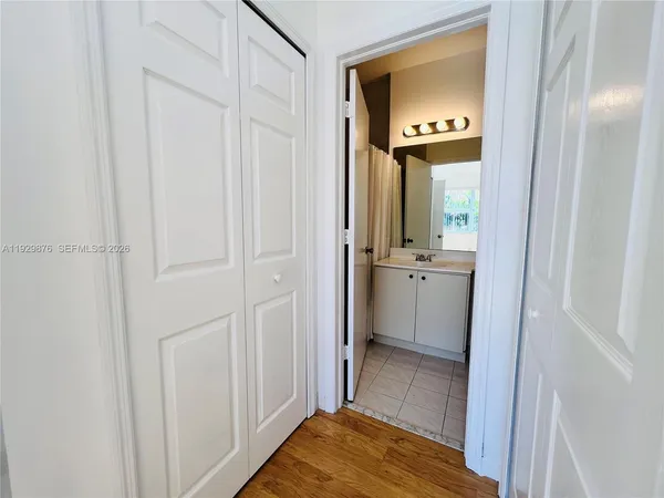 a view of a bathroom from the hallway
