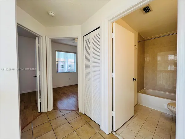 a view of a bathroom with a shower and a sink