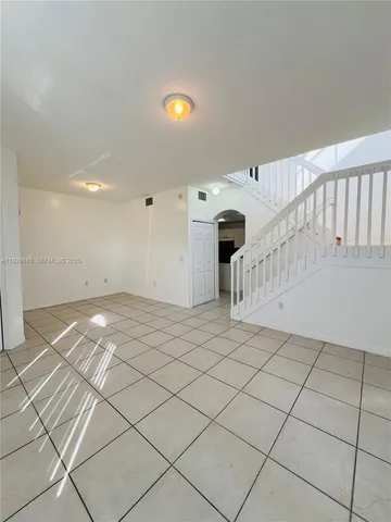 a kitchen with stainless steel appliances granite countertop a refrigerator and a stove