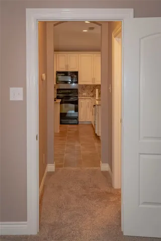 a view of a kitchen with a sink and dishwasher refrigerator