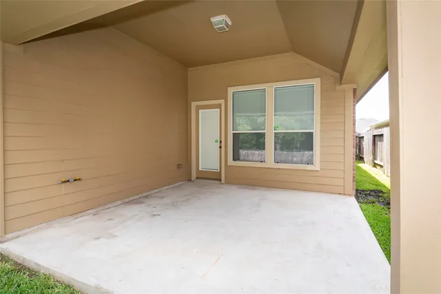 a view of an empty room with a window