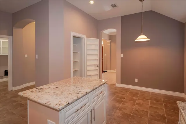 a bathroom with a sink vanity and a mirror
