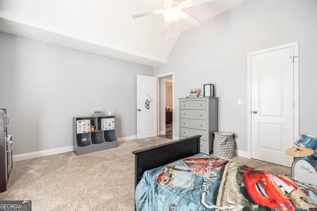 a bedroom with a bed and dresser