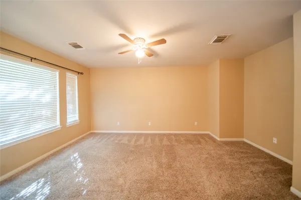 a view of an empty room with a window