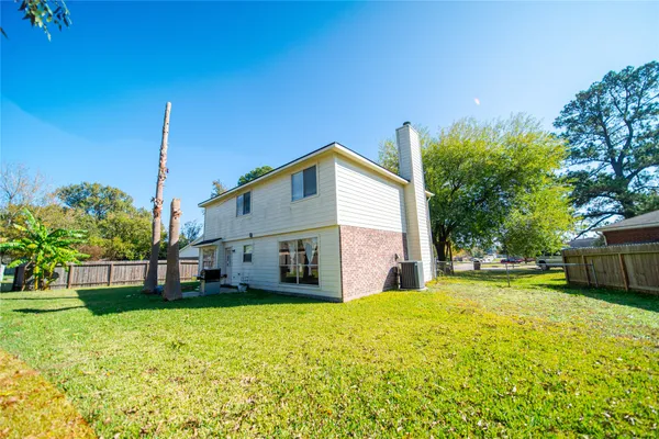a view of a house with a backyard
