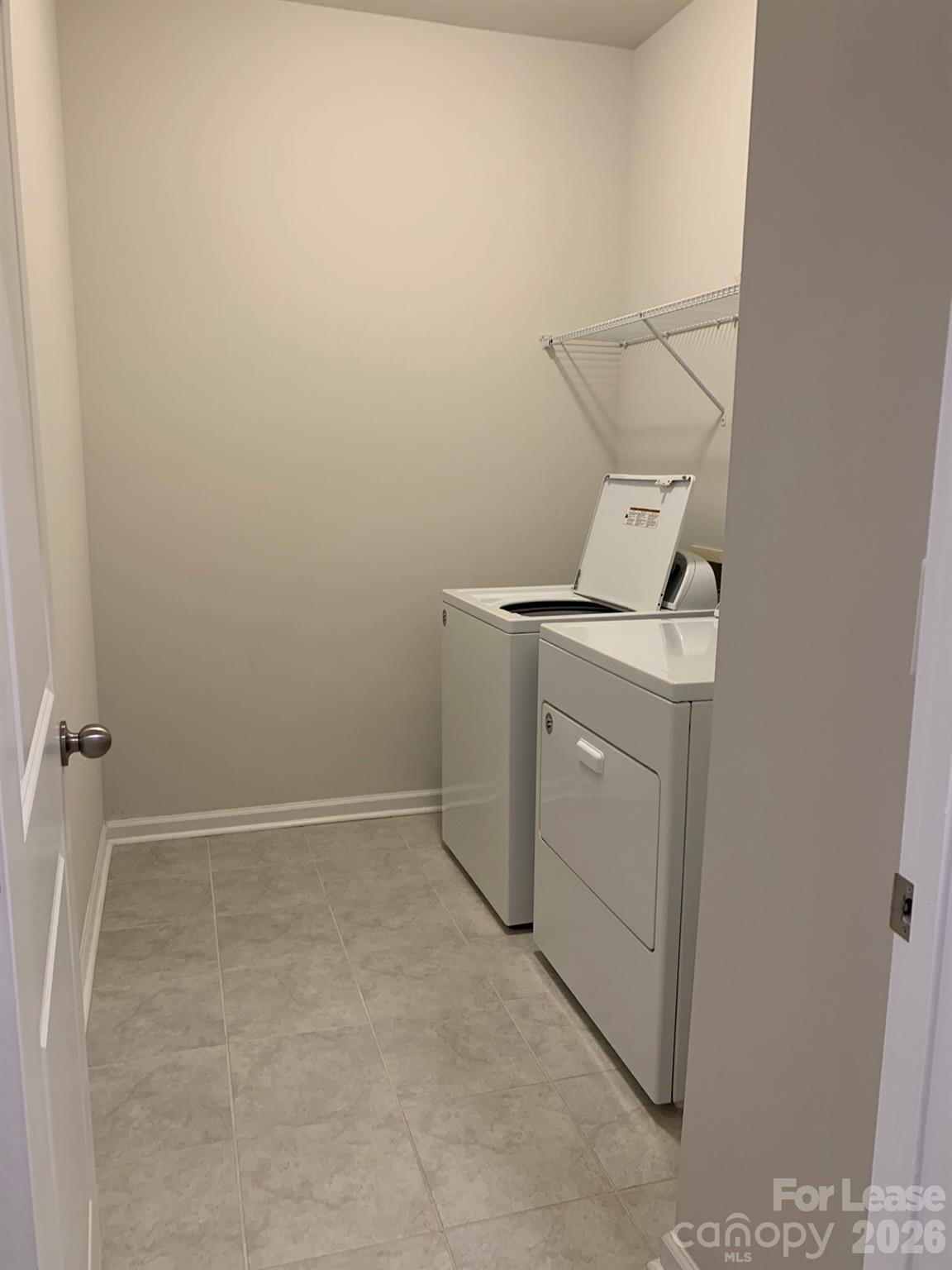 2143 Stevens Mill Road Matthews, NC 28104 - Photo 29 of 39 a utility room with dryer and washer