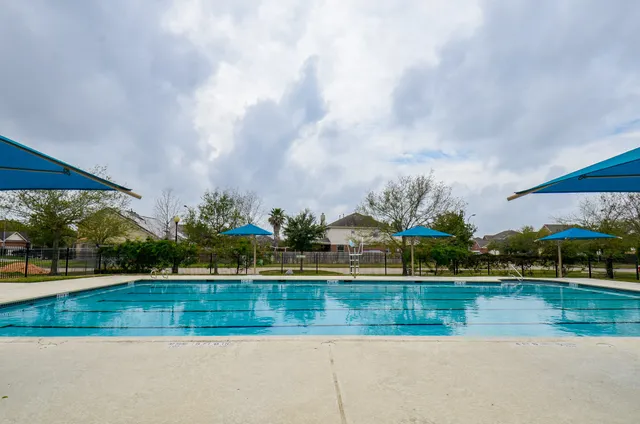 a view of swimming pool is middle in the yard
