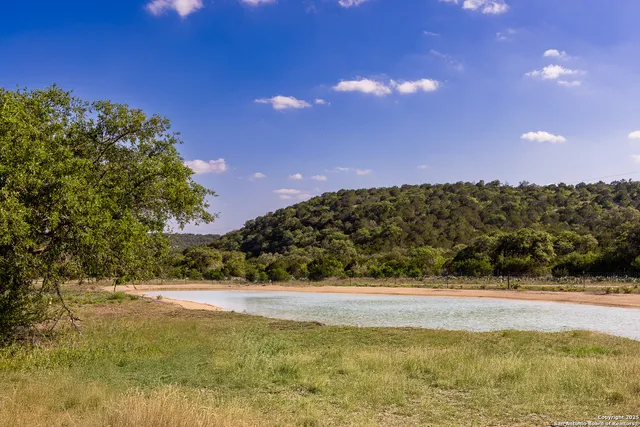 a view of lake with a yard