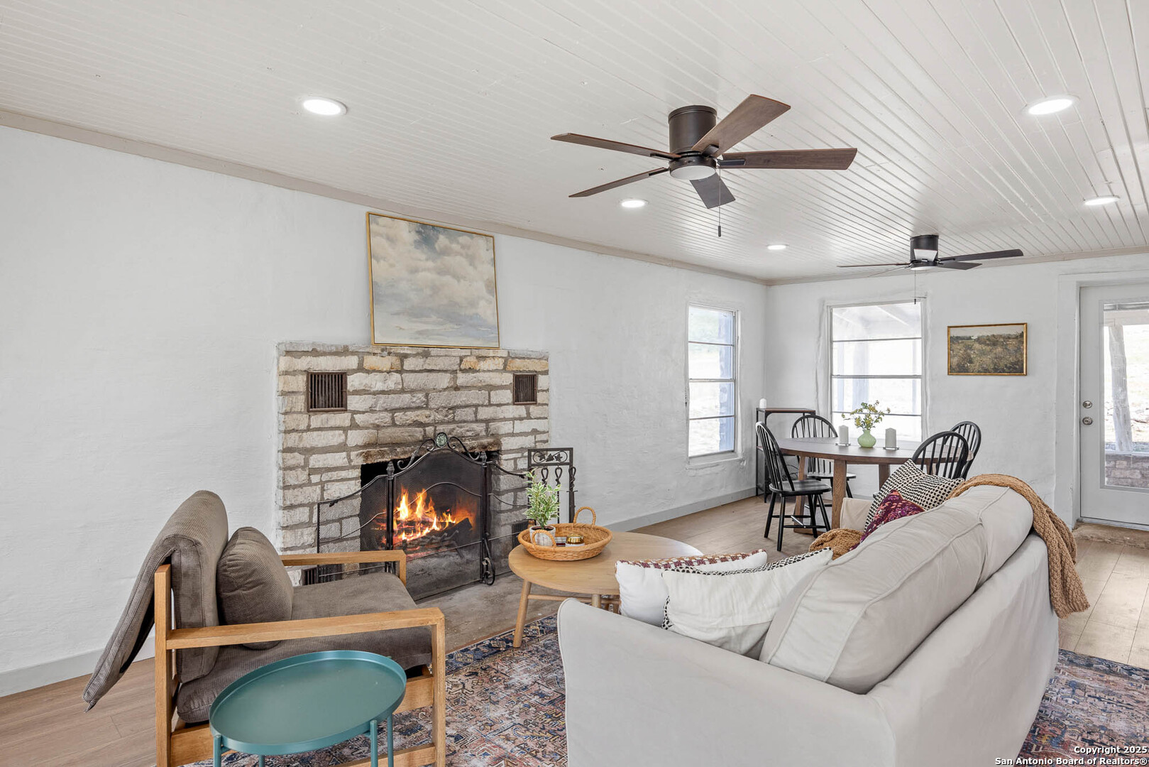 14910 Bullhead Road Barksdale, TX 78880 - Photo 12 of 50 a living room with furniture a fireplace and a ceiling fan