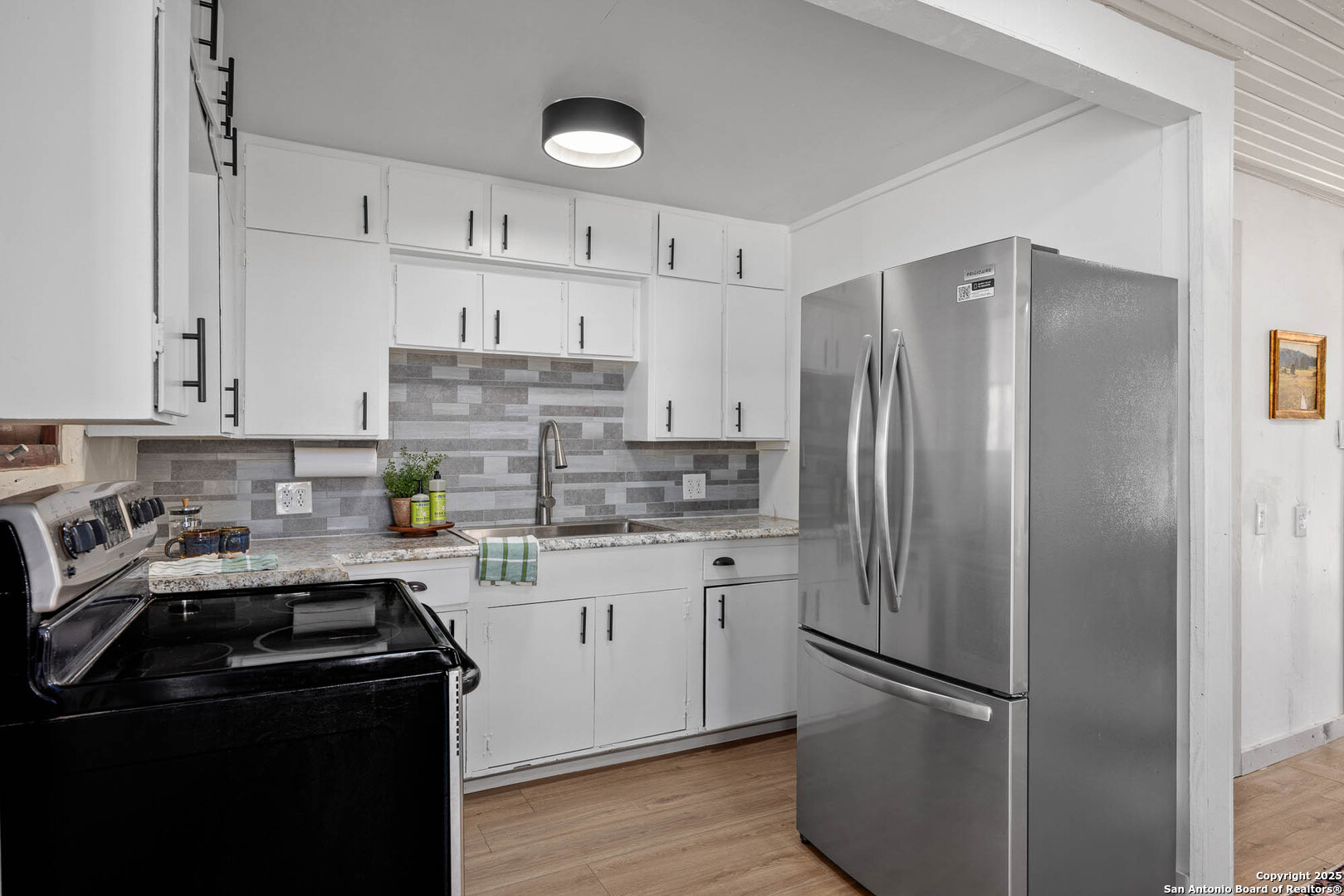 14910 Bullhead Road Barksdale, TX 78880 - Photo 13 of 50 a kitchen with stainless steel appliances a refrigerator sink and cabinets