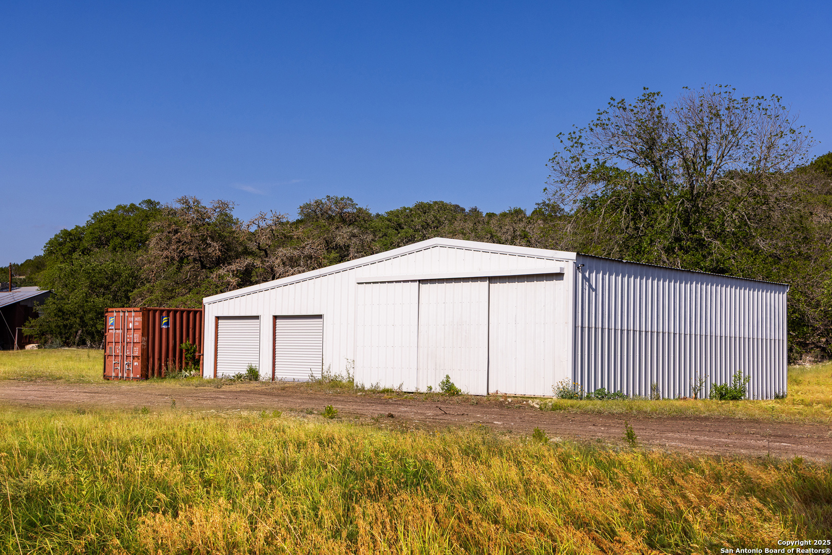 14910 Bullhead Road Barksdale, TX 78880 - Photo 30 of 50 a view of a house with a yard and tree