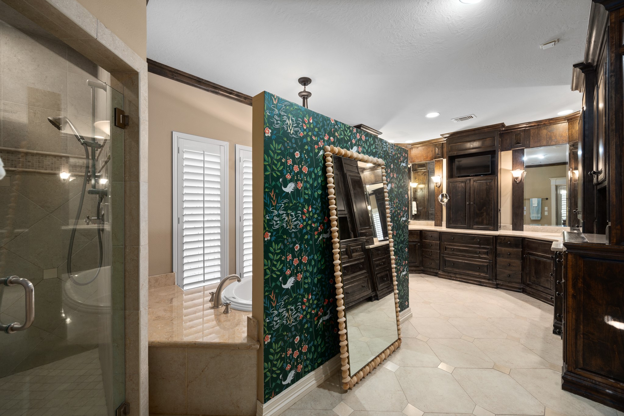 8807 Chelmsford Lane Spring, TX 77379 - Photo 27 of 50 The walk in shower is to the left and the huge soaking tub is hidden behind a decorative wall.