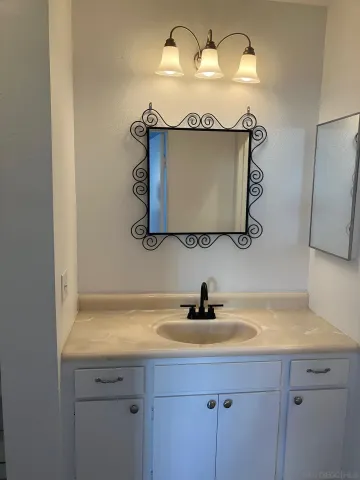 a sink with a sink and a mirror