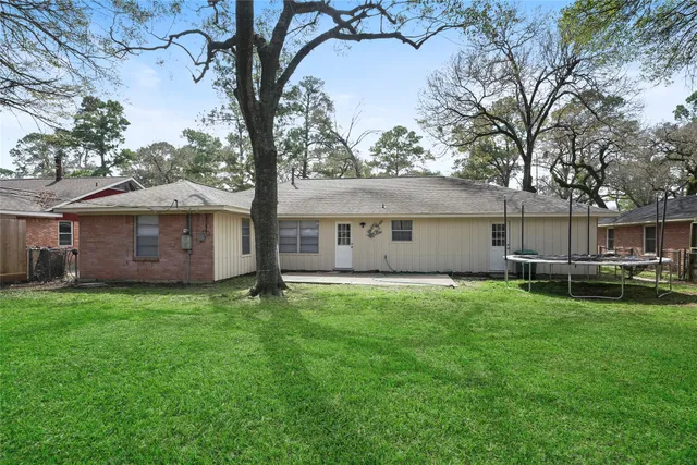 a view of outdoor space with deck and yard