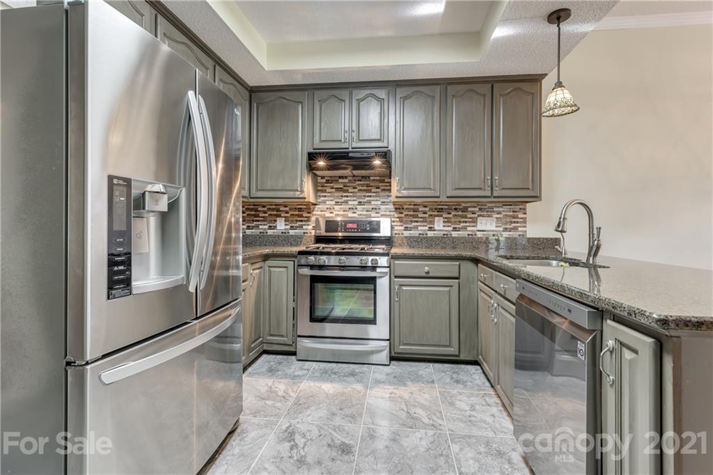 711 Monticello Drive Fort Mill, SC 29708 - Photo 13 of 45 a kitchen with a refrigerator sink and cabinets