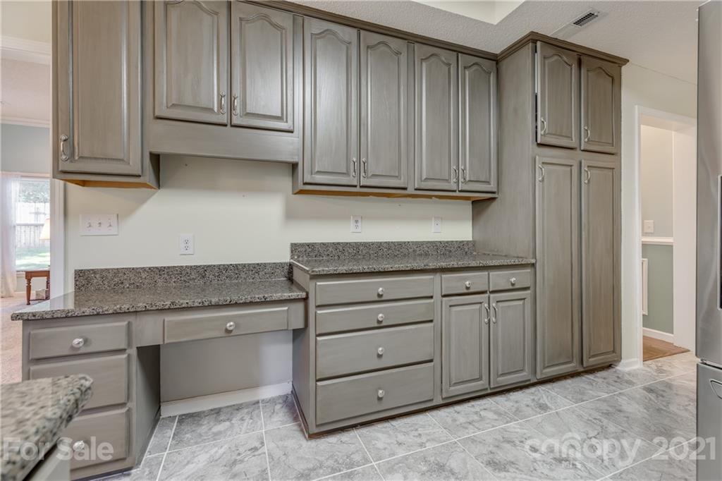 711 Monticello Drive Fort Mill, SC 29708 - Photo 14 of 45 a kitchen with granite countertop cabinets and appliances