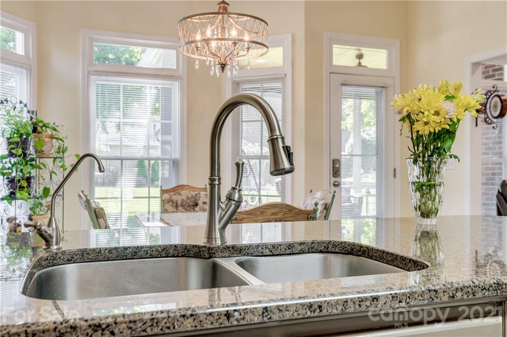 711 Monticello Drive Fort Mill, SC 29708 - Photo 15 of 45 a bathroom with a granite countertop tub and a window