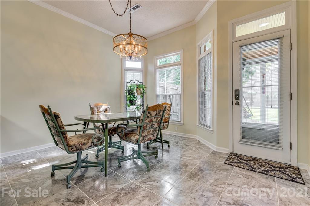 711 Monticello Drive Fort Mill, SC 29708 - Photo 17 of 45 a view of a dining room with furniture window and outside view