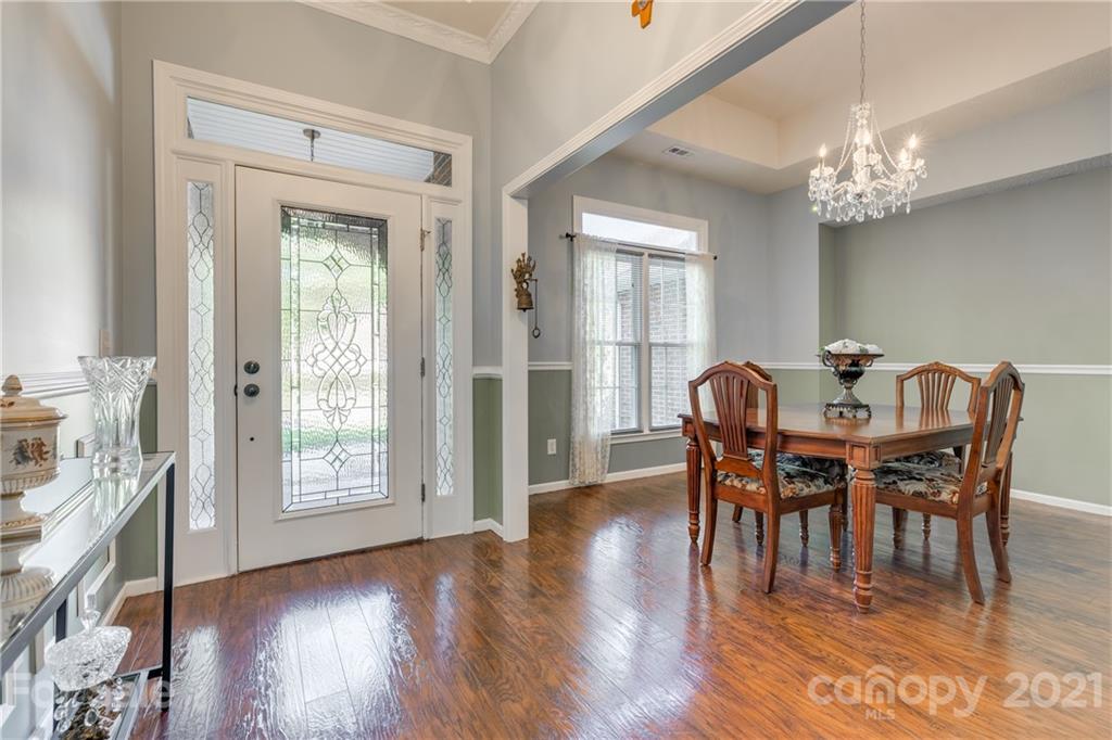 711 Monticello Drive Fort Mill, SC 29708 - Photo 3 of 45 a view of a dining room with furniture window and wooden floor