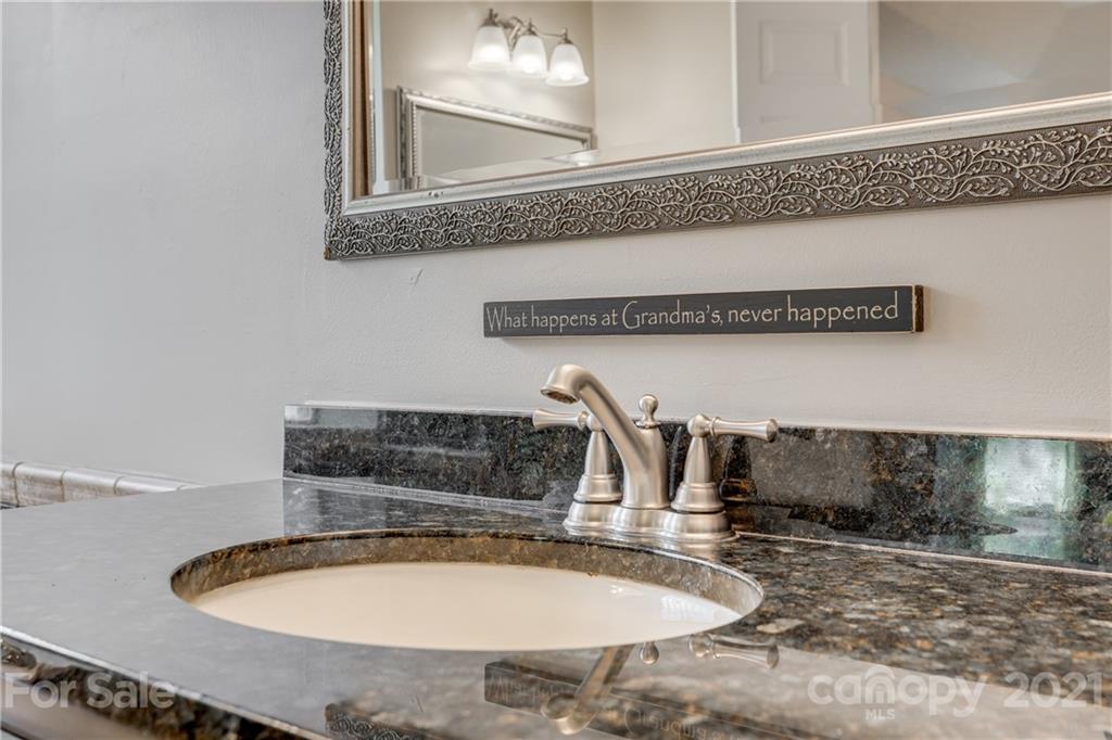711 Monticello Drive Fort Mill, SC 29708 - Photo 25 of 45 a bathroom with a sink and a mirror