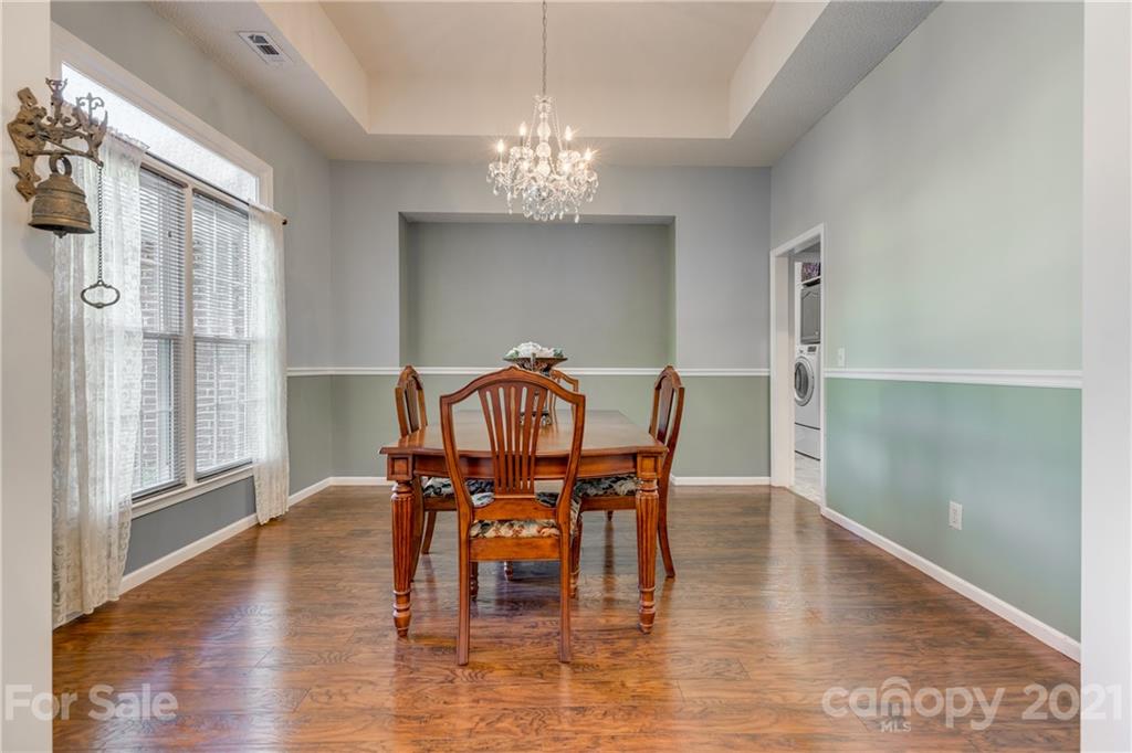 711 Monticello Drive Fort Mill, SC 29708 - Photo 4 of 45 a view of a dining room with furniture window and wooden floor