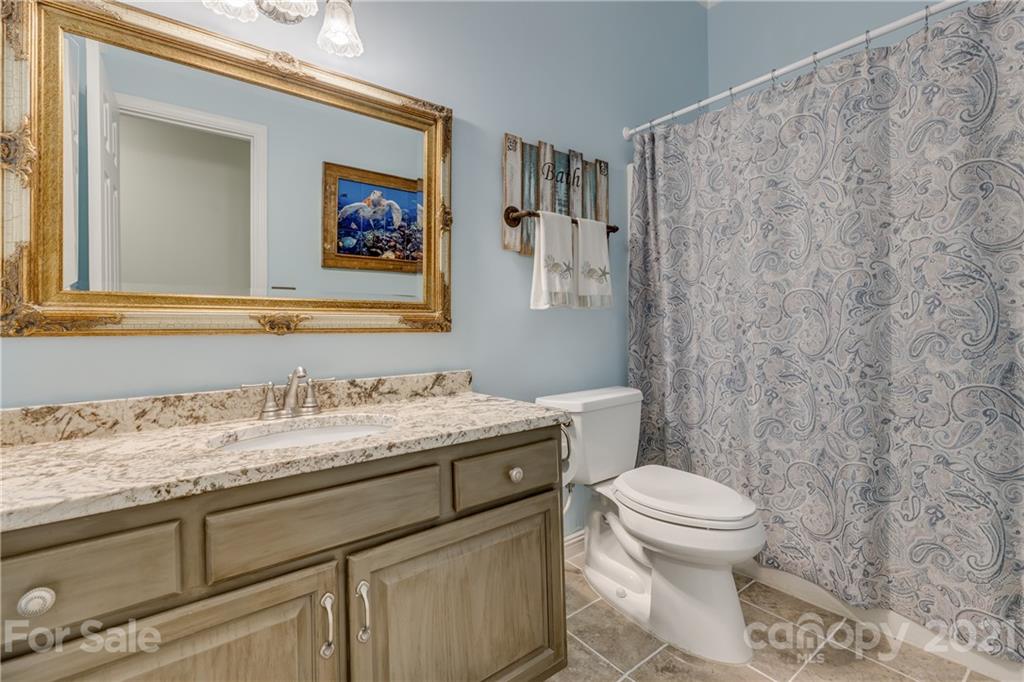 711 Monticello Drive Fort Mill, SC 29708 - Photo 31 of 45 a bathroom with a granite countertop toilet sink and mirror