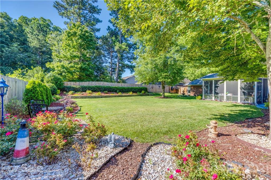 711 Monticello Drive Fort Mill, SC 29708 - Photo 36 of 45 a view of a garden with flowers and trees