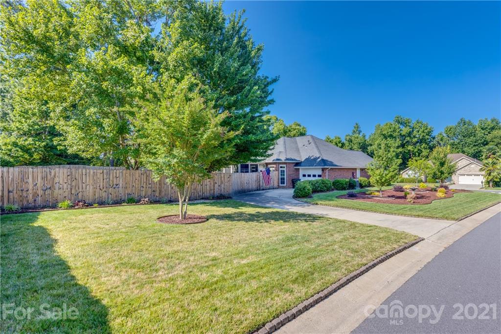 711 Monticello Drive Fort Mill, SC 29708 - Photo 40 of 45 a swimming pool with wooden fence