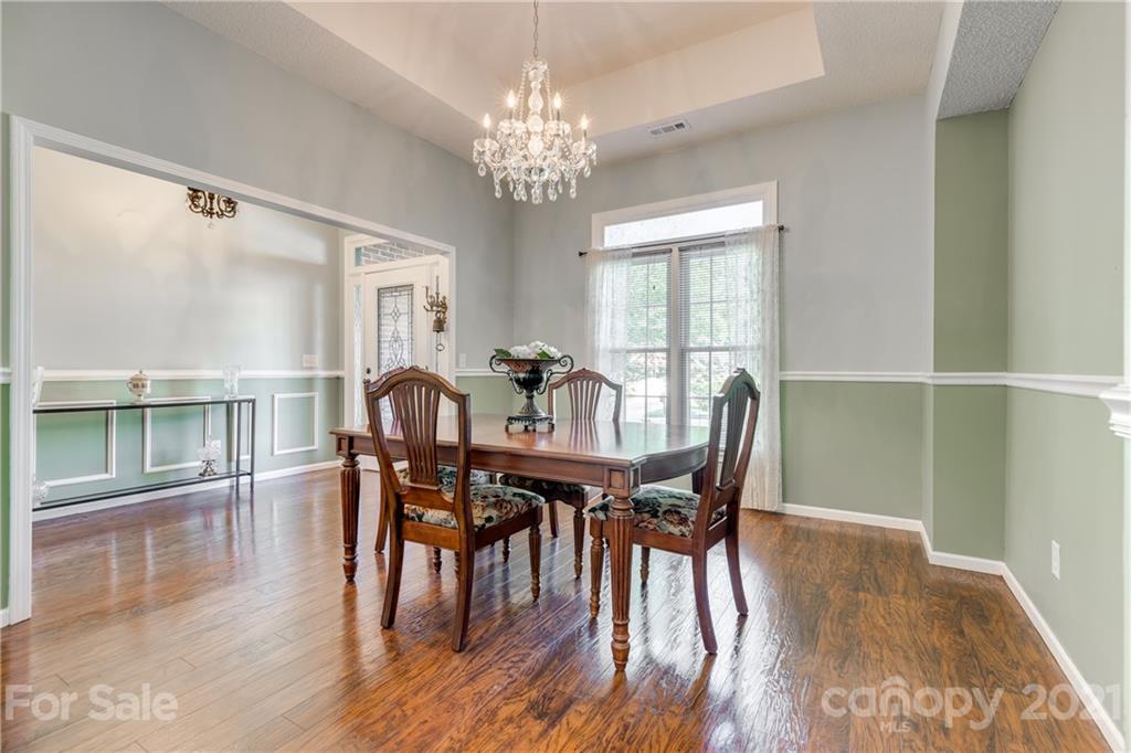 711 Monticello Drive Fort Mill, SC 29708 - Photo 5 of 45 a view of a dining room with furniture window and wooden floor