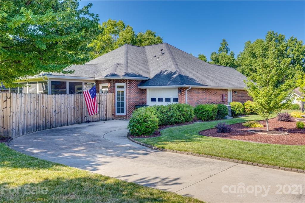 711 Monticello Drive Fort Mill, SC 29708 - Photo 41 of 45 a house with garden in front of it