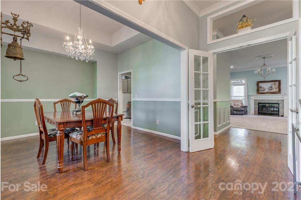 711 Monticello Drive Fort Mill, SC 29708 - Photo 6 of 45 a view of a dining room with furniture and wooden floor