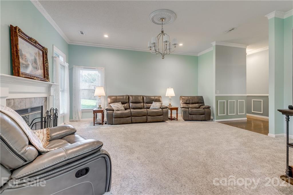 711 Monticello Drive Fort Mill, SC 29708 - Photo 8 of 45 a living room with furniture and a fireplace