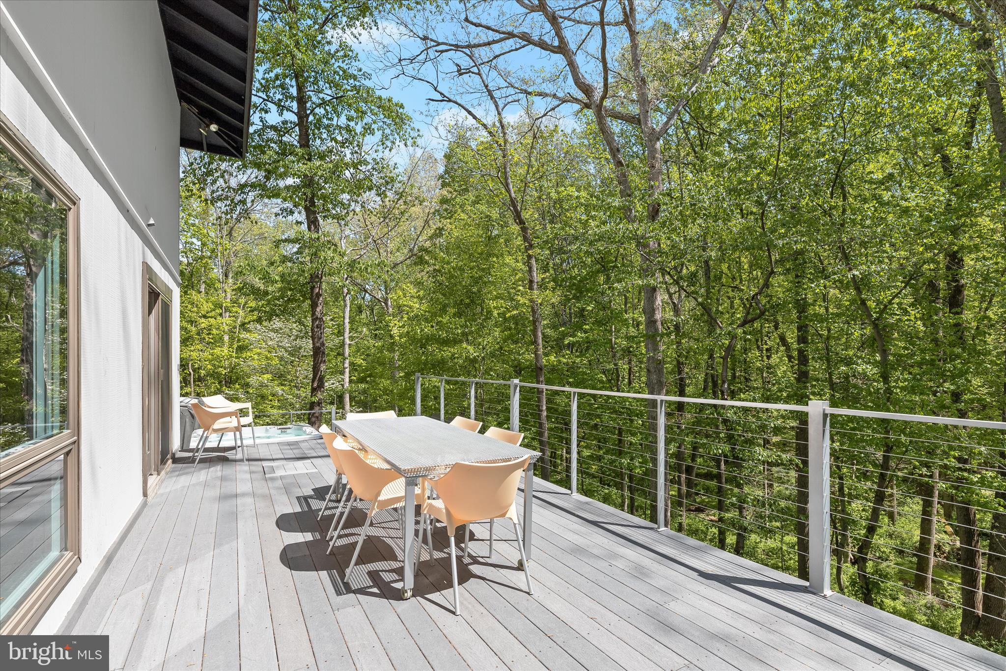 927 Buckhorn Road Sykesville, MD 21784 - Photo 66 of 147 a view of a chairs and table on the wooden deck