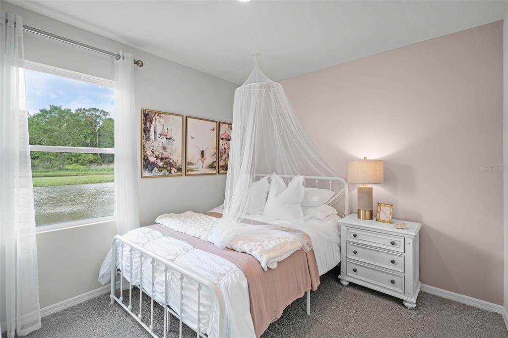 3421 Nettle Loop Tavares, FL 32778 - Photo 23 of 30 a bedroom with a bed and a window