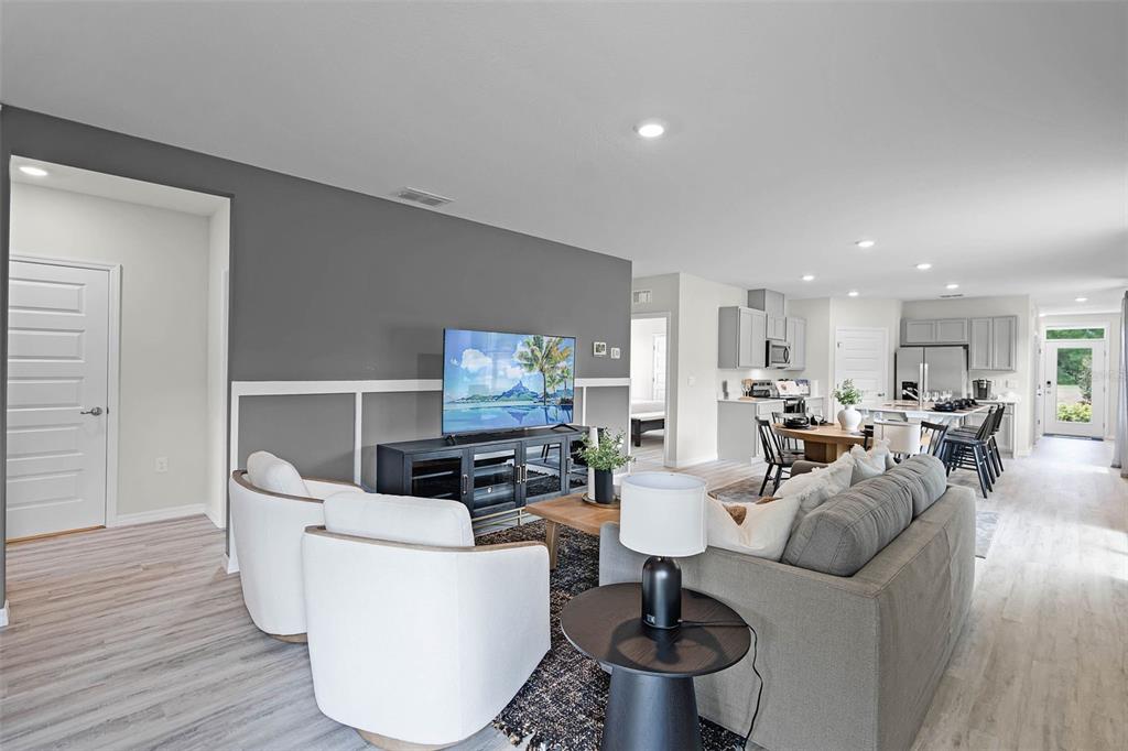 3421 Nettle Loop Tavares, FL 32778 - Photo 3 of 30 a living room with furniture and a wooden floor