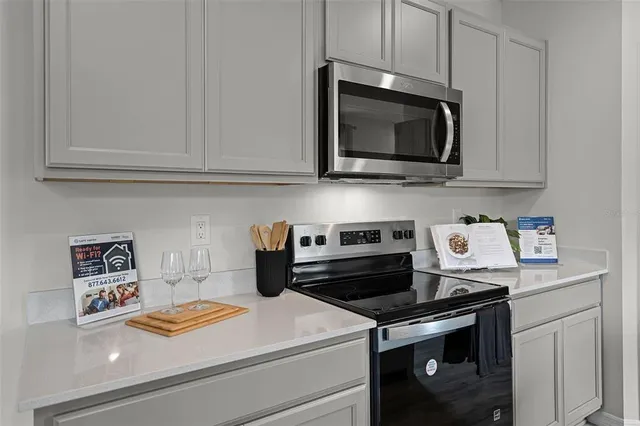 a kitchen with a stove and a microwave