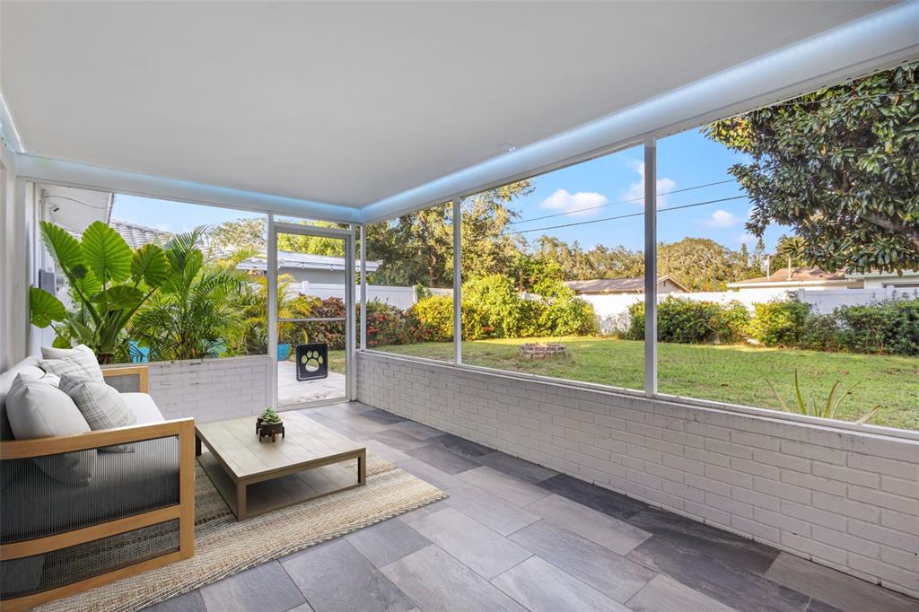 2033 Little Neck Road Clearwater, FL 33755 - Photo 8 of 39 Virtually staged screened-in patio/lanai