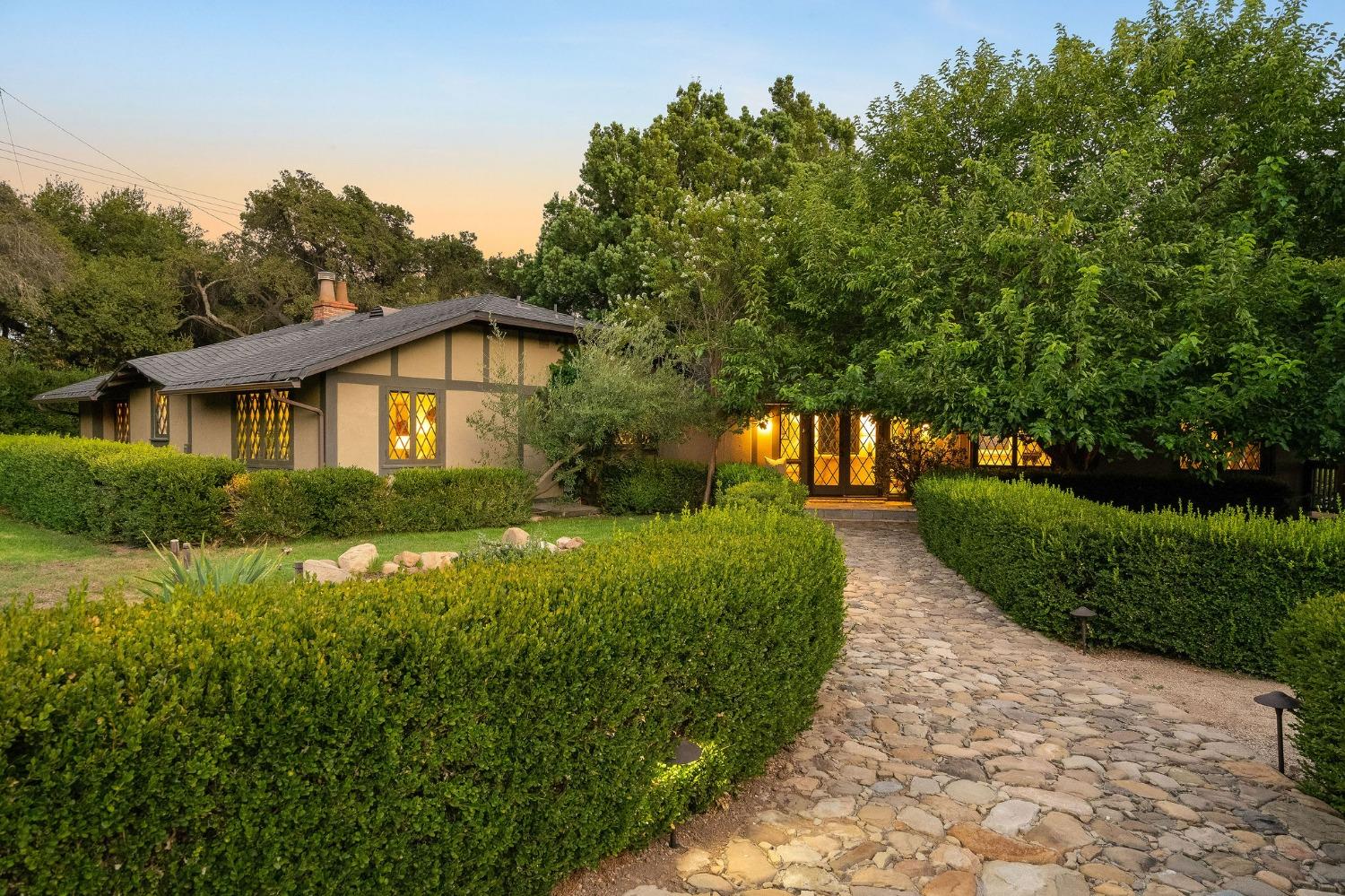 1001 Foothill Road Ojai, CA 93023 - Photo 1 of 50 a front view of a house with a yard