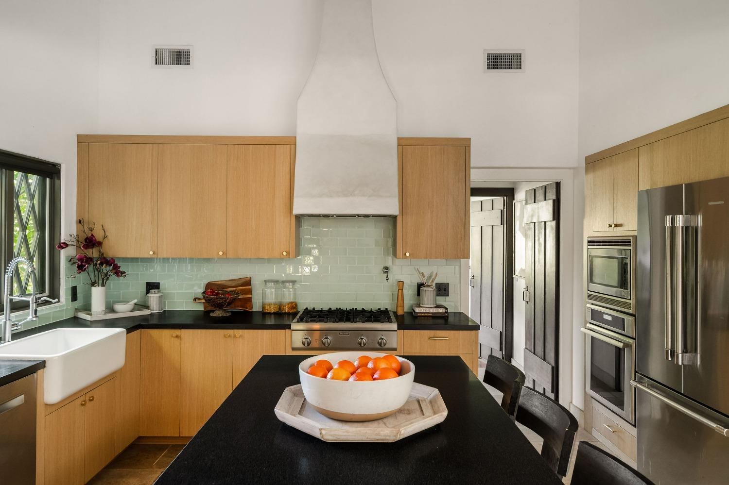 1001 Foothill Road Ojai, CA 93023 - Photo 17 of 50 a kitchen with stainless steel appliances granite countertop a sink and a refrigerator