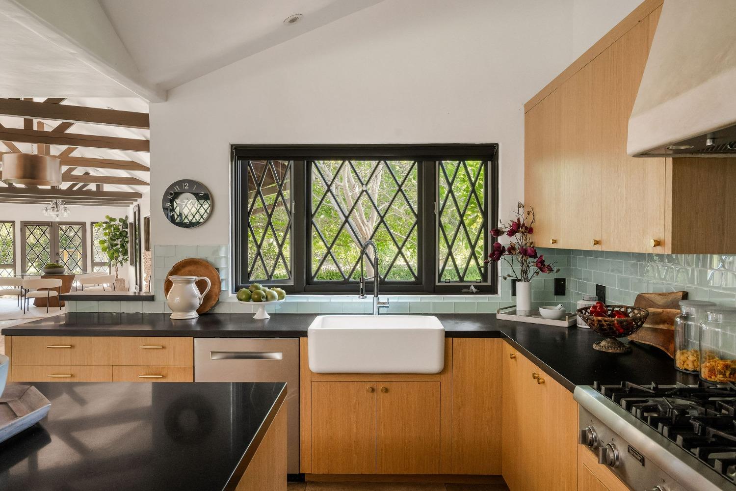 1001 Foothill Road Ojai, CA 93023 - Photo 18 of 50 a kitchen with a sink and a stove top oven