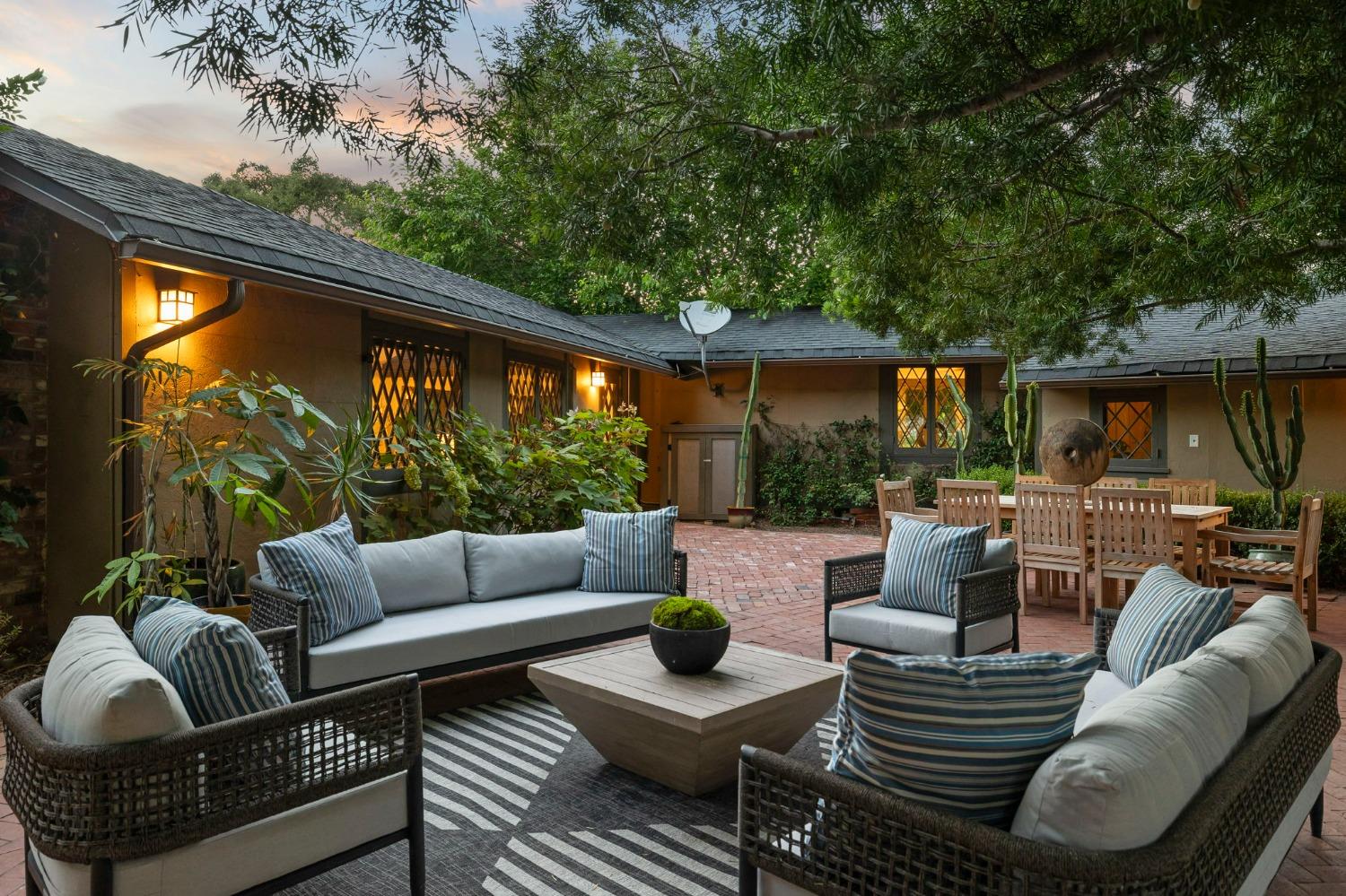 1001 Foothill Road Ojai, CA 93023 - Photo 22 of 50 a view of a patio with couches potted plants and a large window