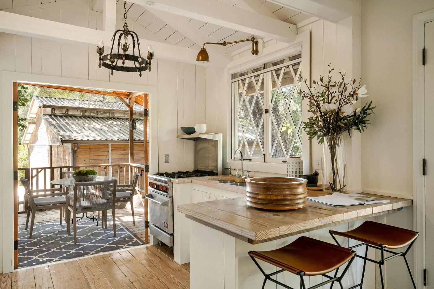 1001 Foothill Road Ojai, CA 93023 - Photo 40 of 50 a view of a dining room with furniture and wooden floor