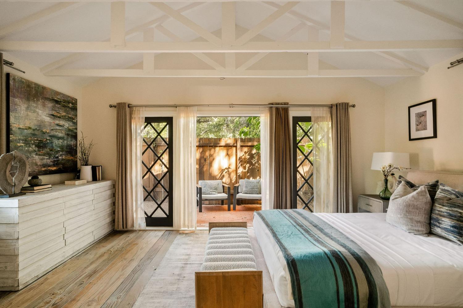 1001 Foothill Road Ojai, CA 93023 - Photo 43 of 50 a bedroom with a bed and a large window