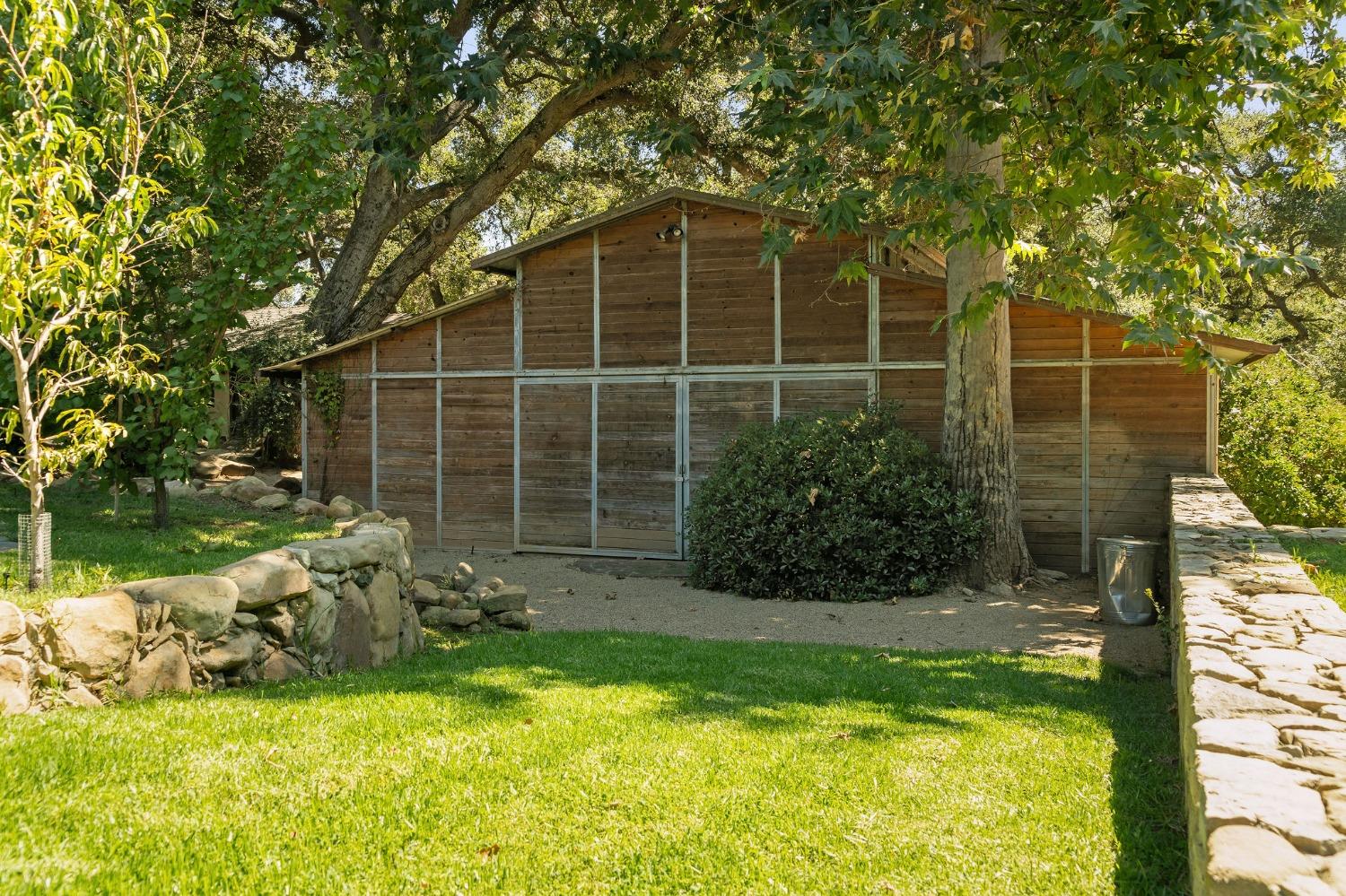 1001 Foothill Road Ojai, CA 93023 - Photo 44 of 50 a view of a house with a yard and sitting area