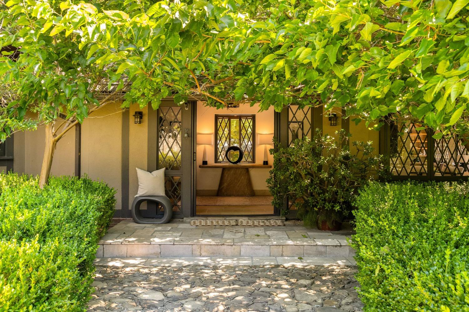 1001 Foothill Road Ojai, CA 93023 - Photo 7 of 50 a front view of a house with a garden