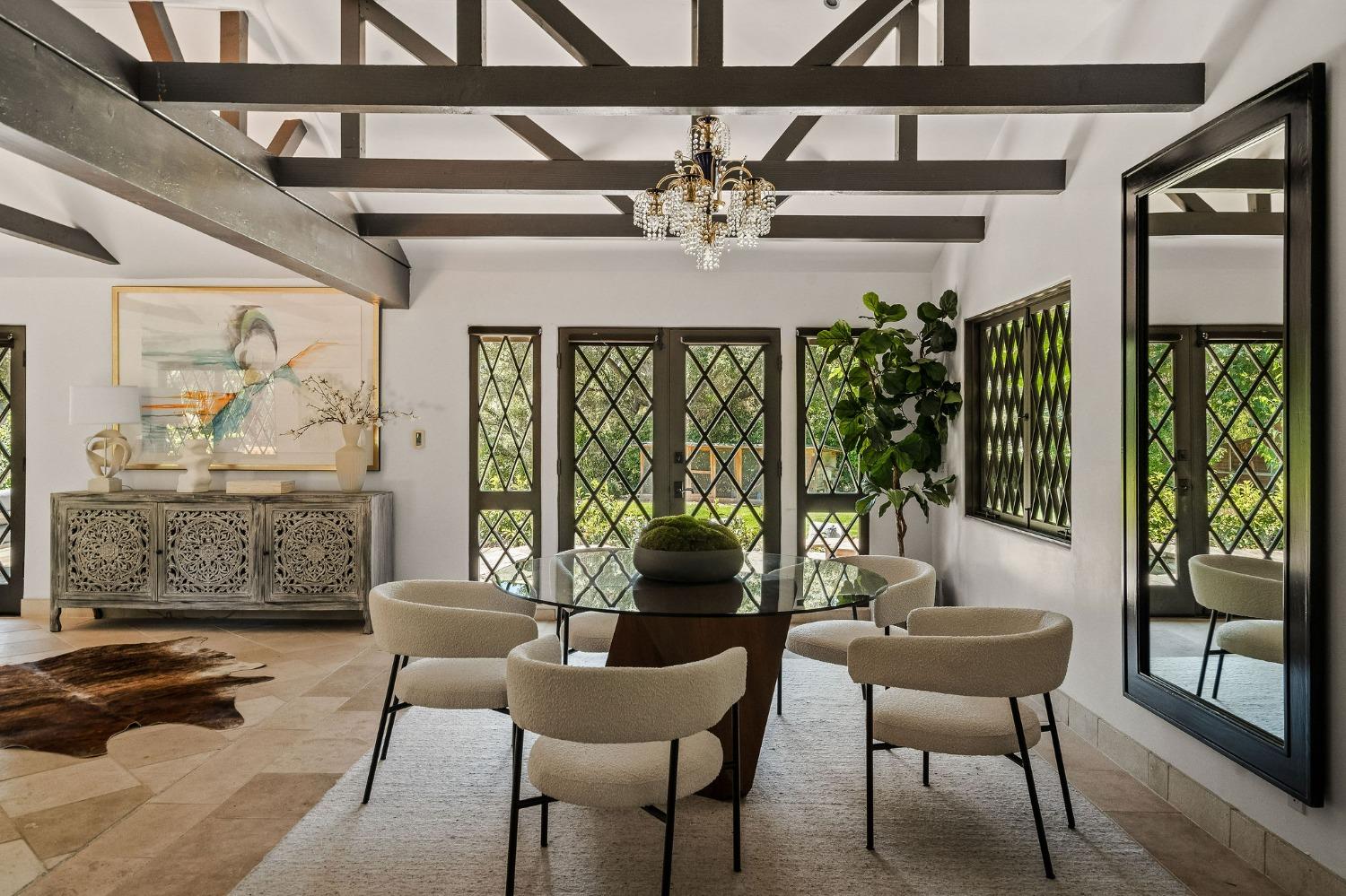 1001 Foothill Road Ojai, CA 93023 - Photo 10 of 50 a dining room with furniture a chandelier and wooden floor