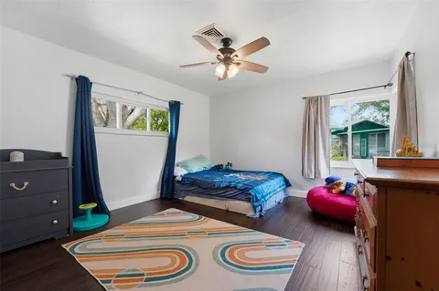 a bedroom with bed and a window