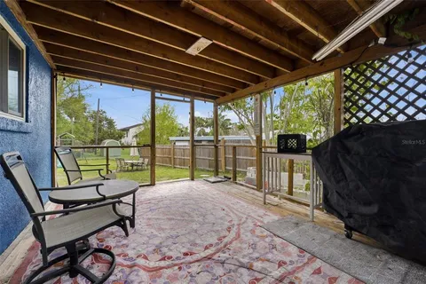 a view of a chairs and table in the patio